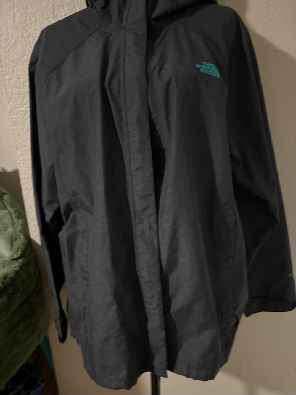 The North Face Black Raincoat with Teal Logo